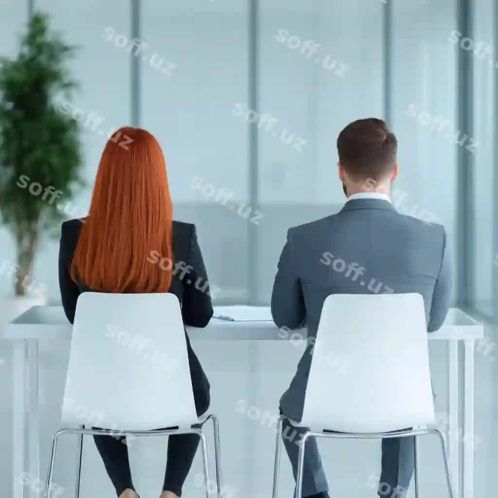 Ikki kasblashgan odam zamonaviy ofis muhitida stolda o'tirgan | Two professionals seated table modern office setting