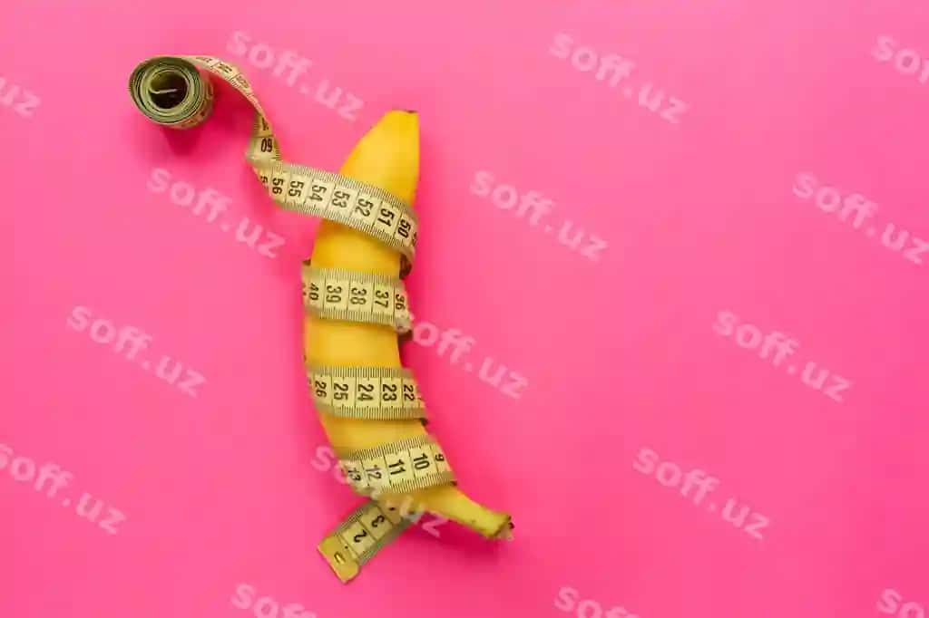 Sariq banan o'lchov lentasi bilan gulbino yuza | Yellow banana with measurement tape pink surface